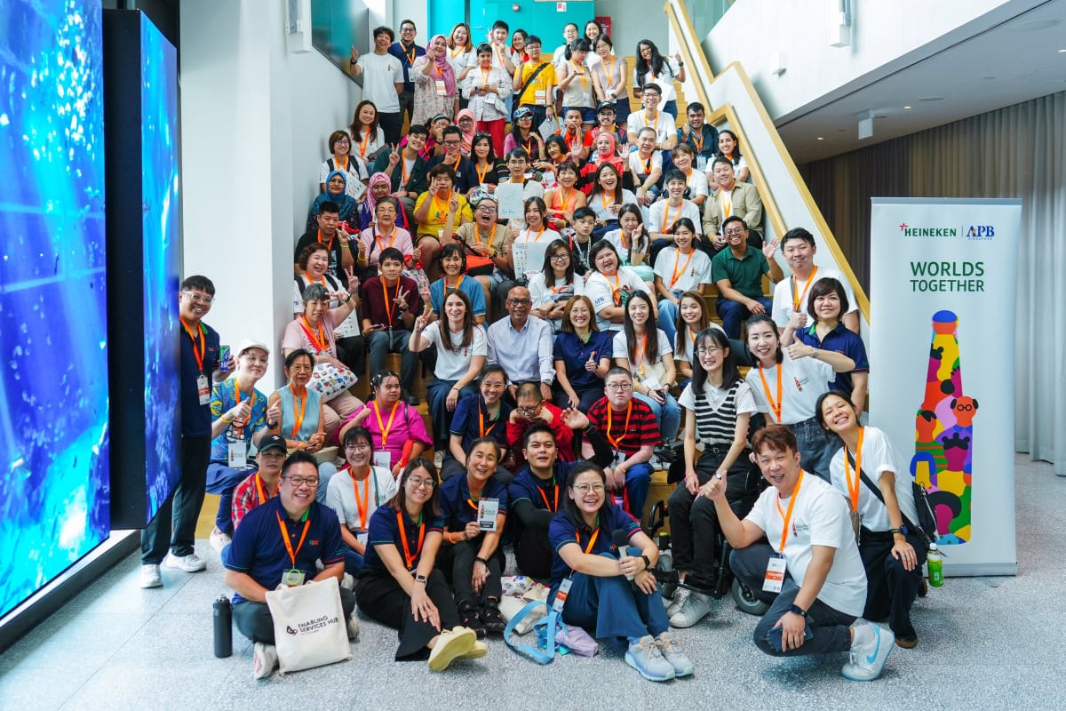 All participants and volunteers seated in on a staircase.