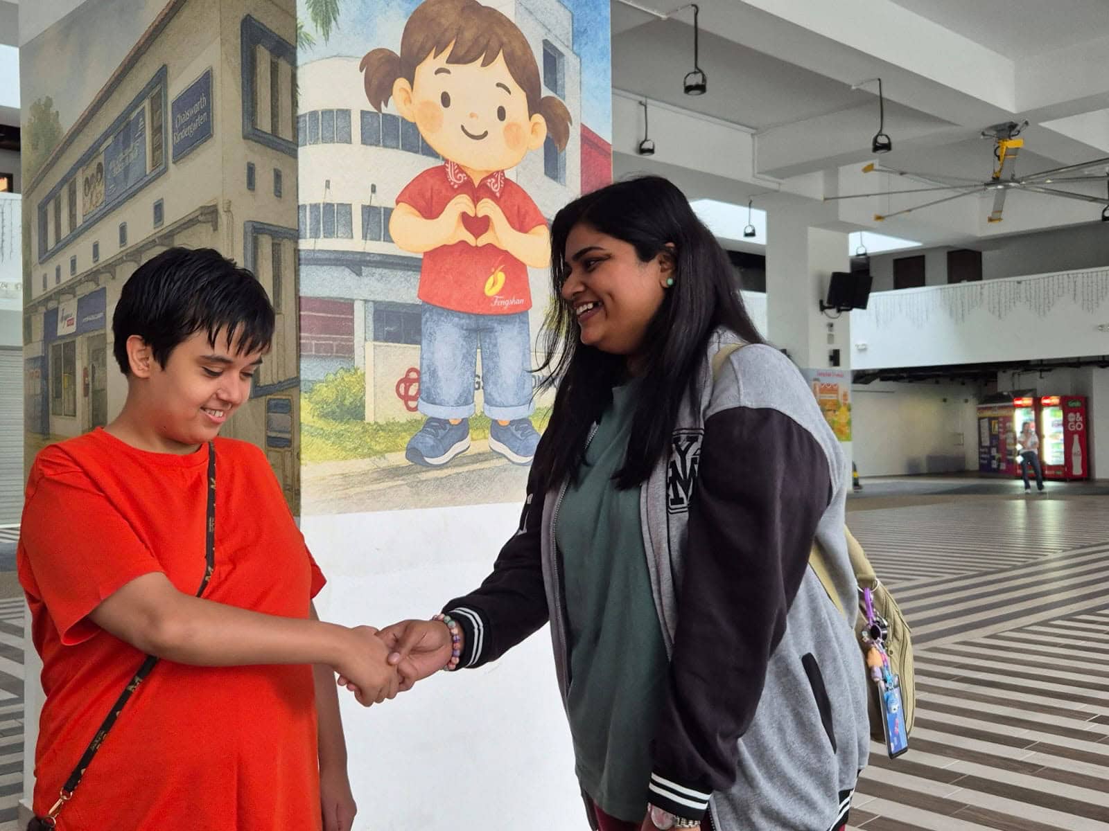 Strength in Community: She Came to Help Others and Found Support Herself 3 Sindhu shaking hands with a client.