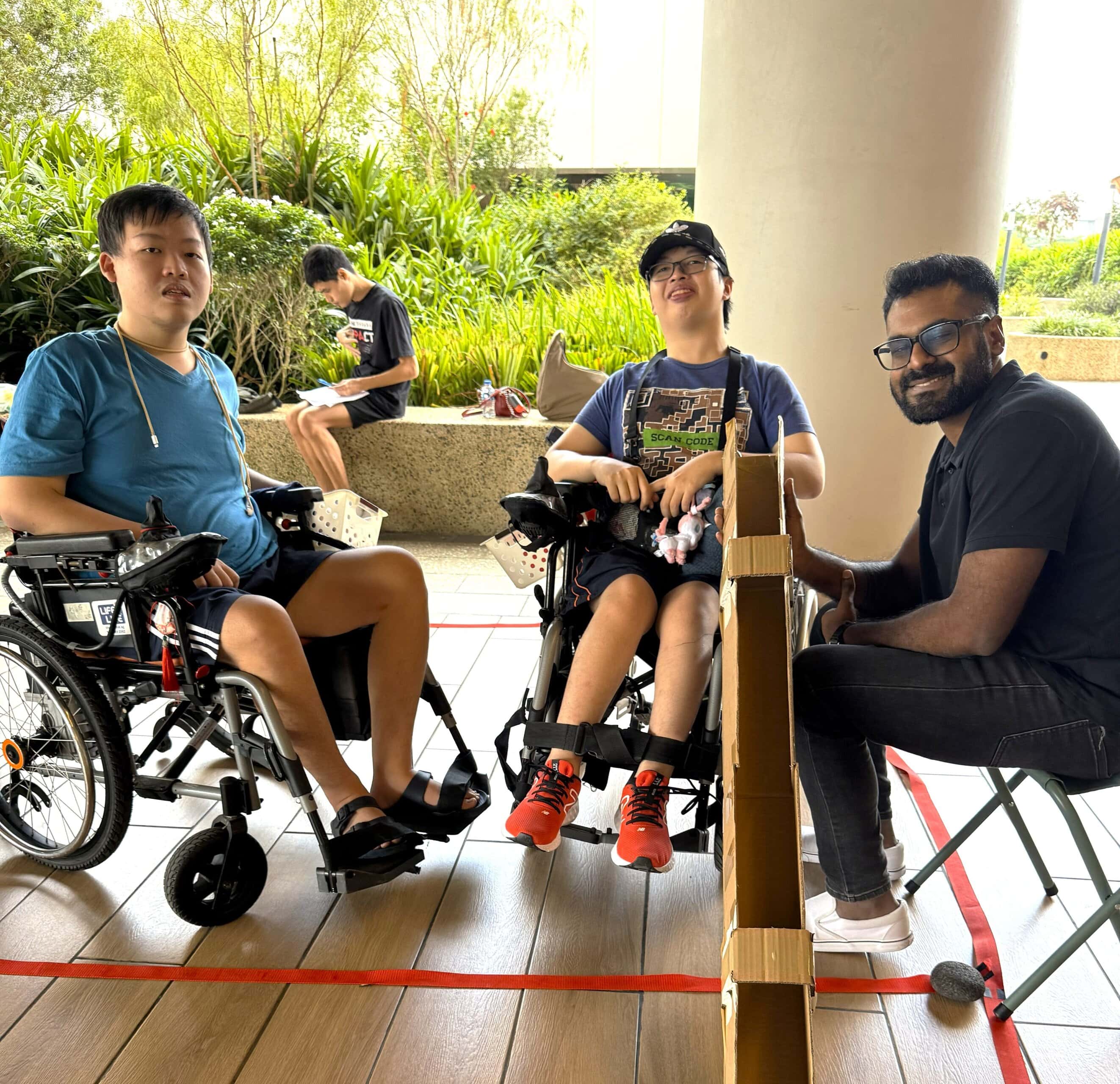 Vinid with 2 E S H Punggol wheelchair users playing boccia
