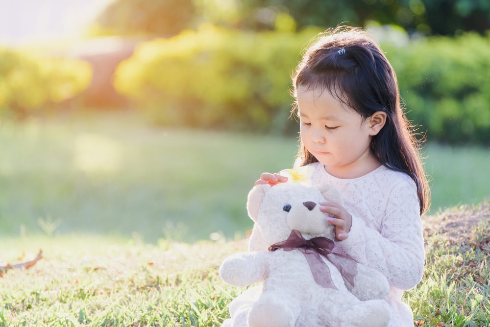 Positive, Not Permissive: Redefining discipline for today’s parents 4 A young girl holding a teddy bear