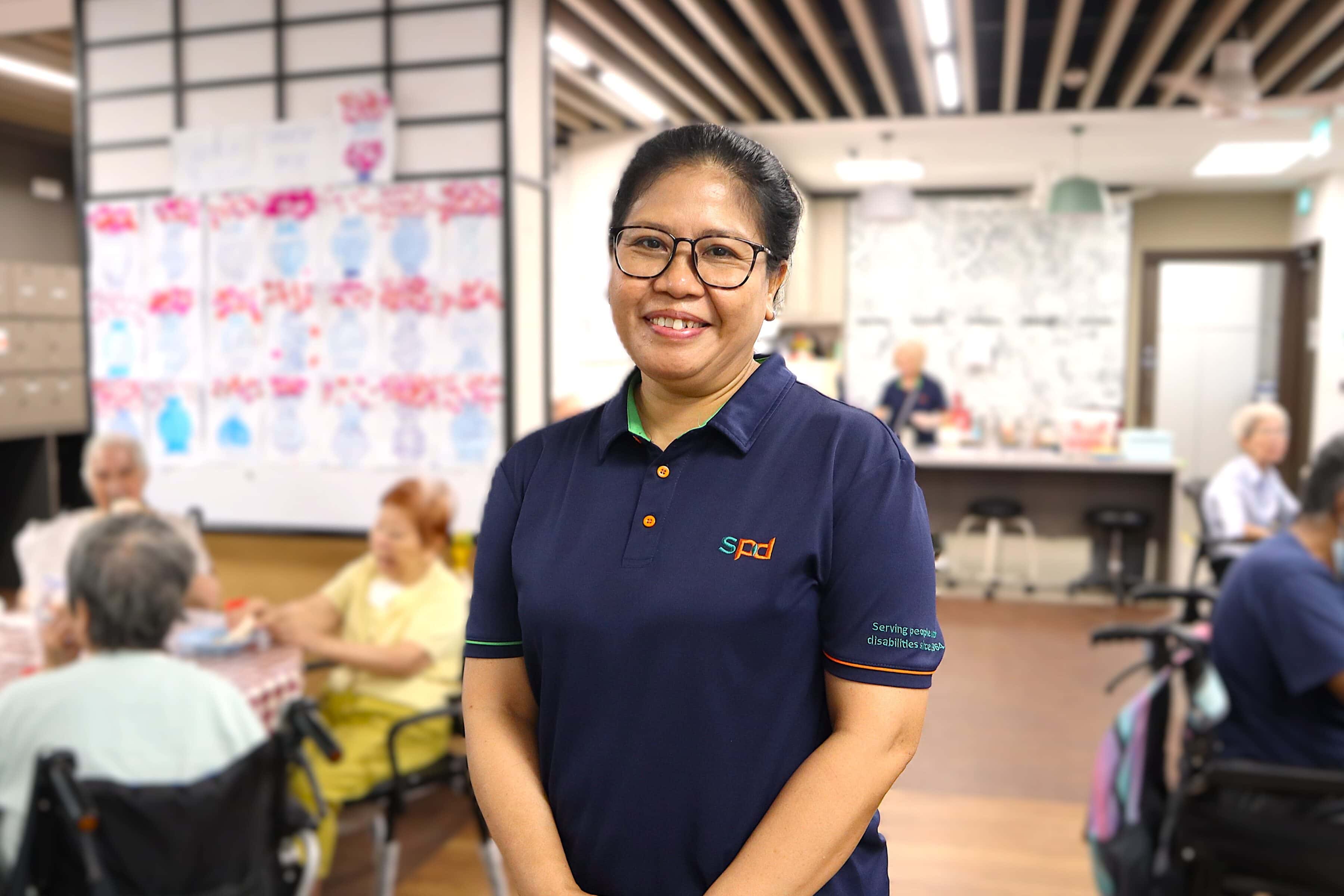 Mas Ayu smiling and at the S P D Toa Payoh senior care centre