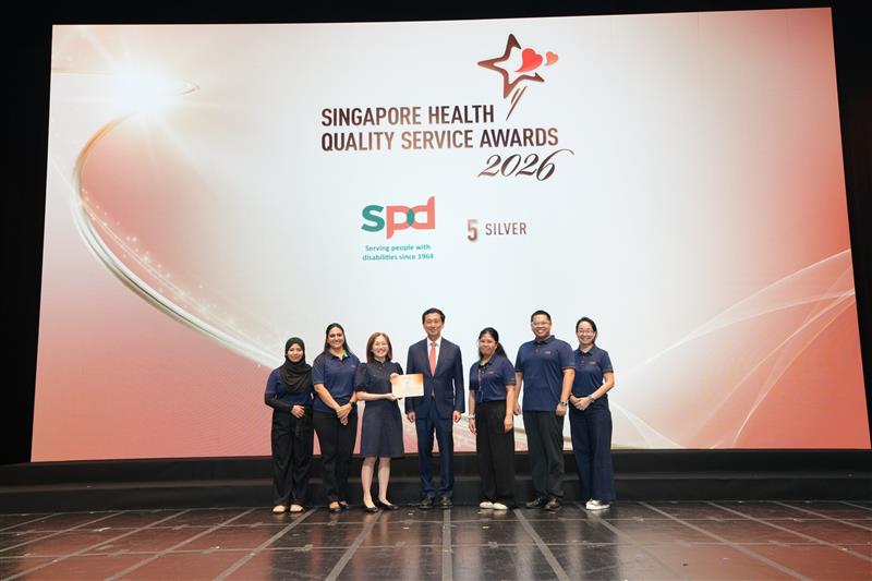 S P D's S H Q S A winners on stage with guest of honour Mr Ong Ye Kung