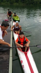 Aaron in a two person kayak boat at Macritchie Reservoir