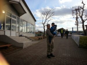 Mr Sim carrying Aaron for a photo in Busan